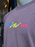 Dare to Love purple tee, close up of the chest print