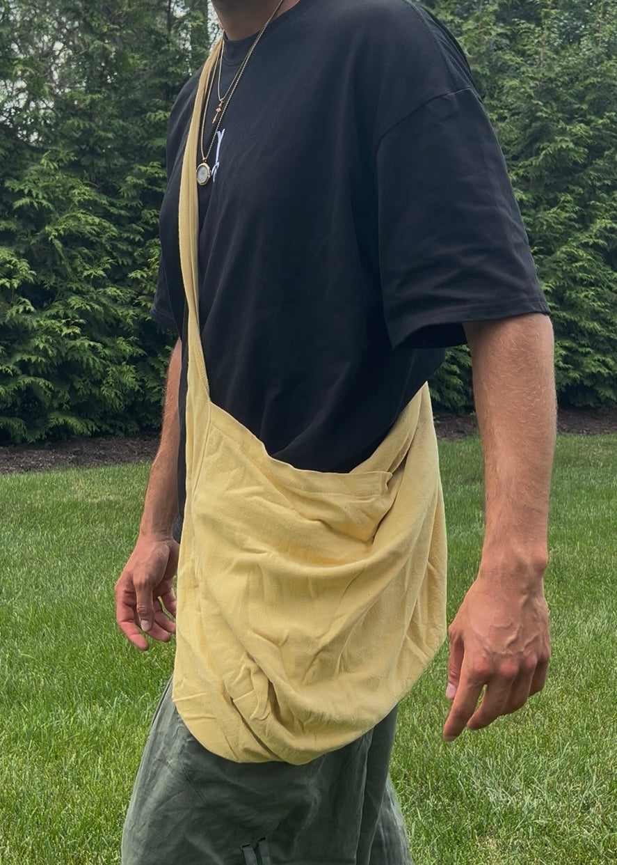 Bottomless Bag in Dandelion, worn crossbody