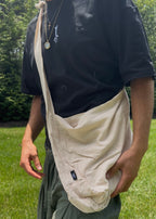 Bottomless Bag in Linen, worn crossbody