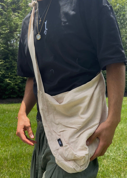 Bottomless Bag in Linen, worn crossbody